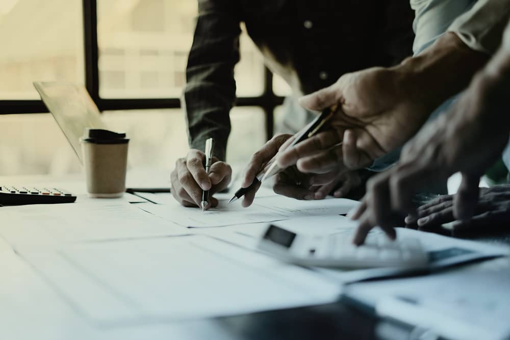 Group of people going over paperwork together